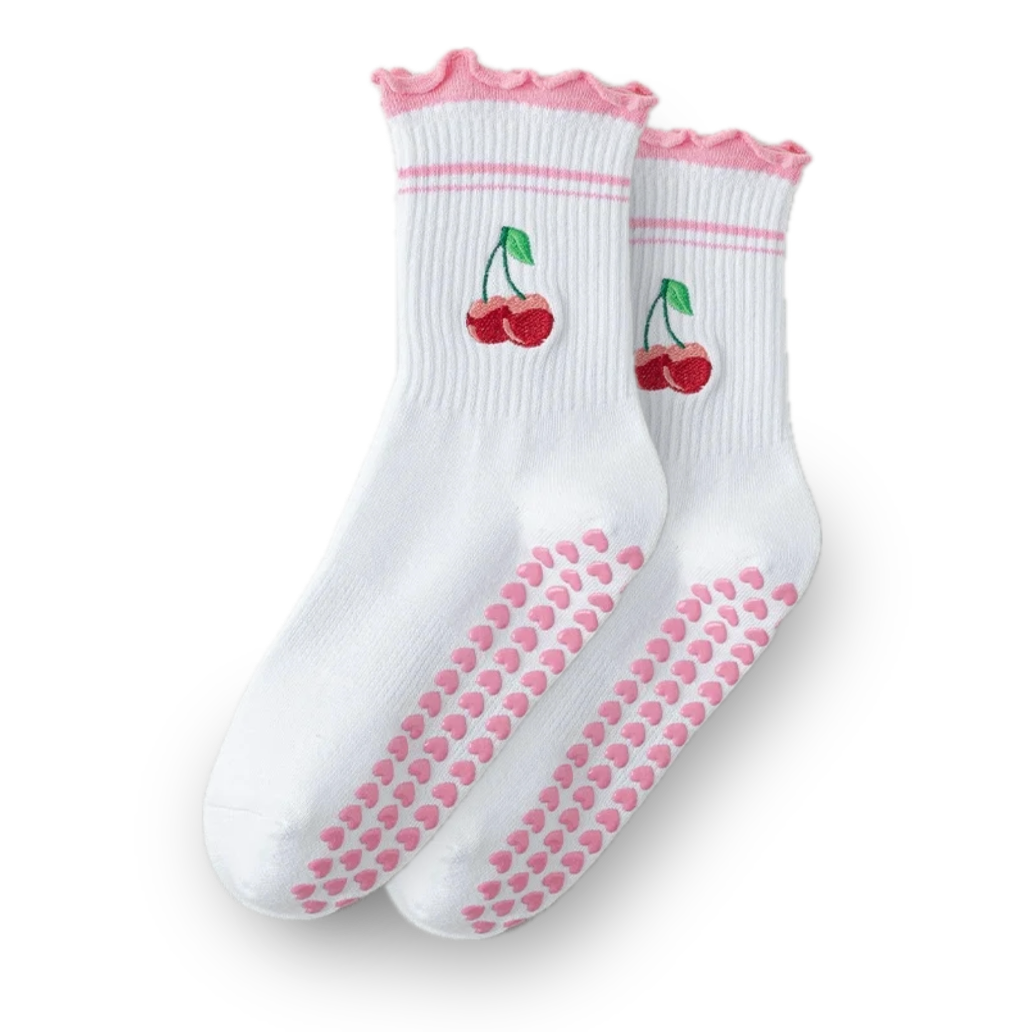 Pair of white crew grip socks with pink ruffled cuffs, dual pink cuff stripes, embroidered cherry design near the ankle, and pink heart-shaped non-slip grips on the soles, displayed on a solid black background, ideal for Pilates, yoga, barre, and cute everyday wear