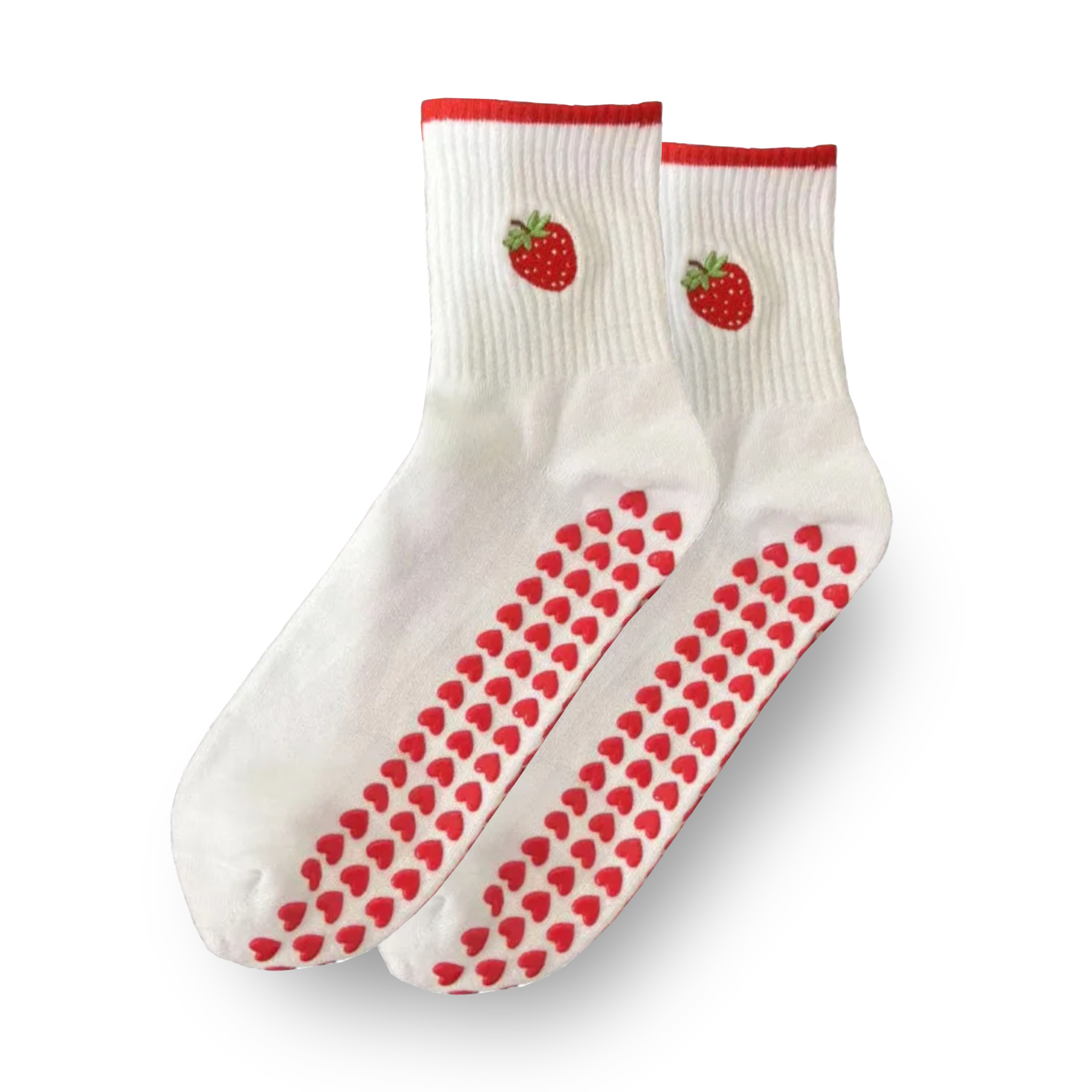Pair of white crew grip socks with bright red cuff trim, embroidered strawberry design near the ankle, and red heart-shaped non-slip grips on the soles, displayed on a solid black background, ideal for Pilates, yoga, barre, and cute everyday wear
